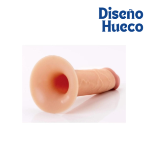 Apertura circular de dildo hueco de silicona color piel que muestra el canal interno para inserción.